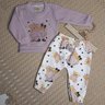 Conjunto Infantil Menina calça na cor off com estampa e blusa na cor lavanda