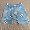 Conjunto Infantil Menino camiseta na cor mescla e shorts na cor azul